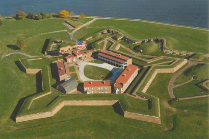 Aerial close-up photo of Fort McHenry Star Fort with U. S. Flag flying and showing shoreline of Patapsco River Baltimore MD