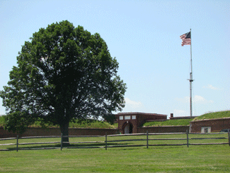 Front entrance to Fort McHenry showing park grounds & replica 1814 US flag that Francis Scott Key saw when writing our National Anthem, Baltimore MD