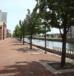 Tree-lined Waterfront Promenade in Harbor East along Jones Falls Canal Baltimore MD