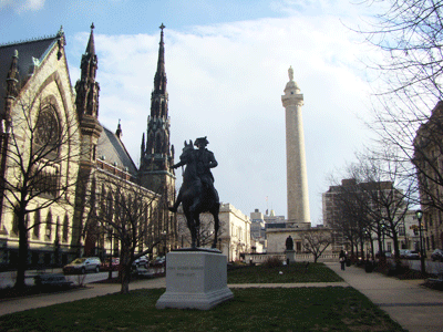 Mount Vernon  Square Image with John Eager Howard statue, Mount Vernon Place United Methodist Church, and Washington Monument in the Background  Baltimore MD