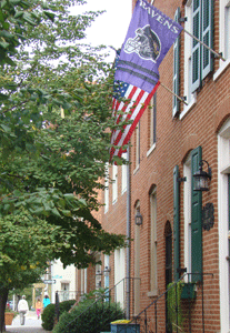 Ravens Flag and U.S. Flag proudly flying on South Charles Street in Federal Hill Baltimore MD
